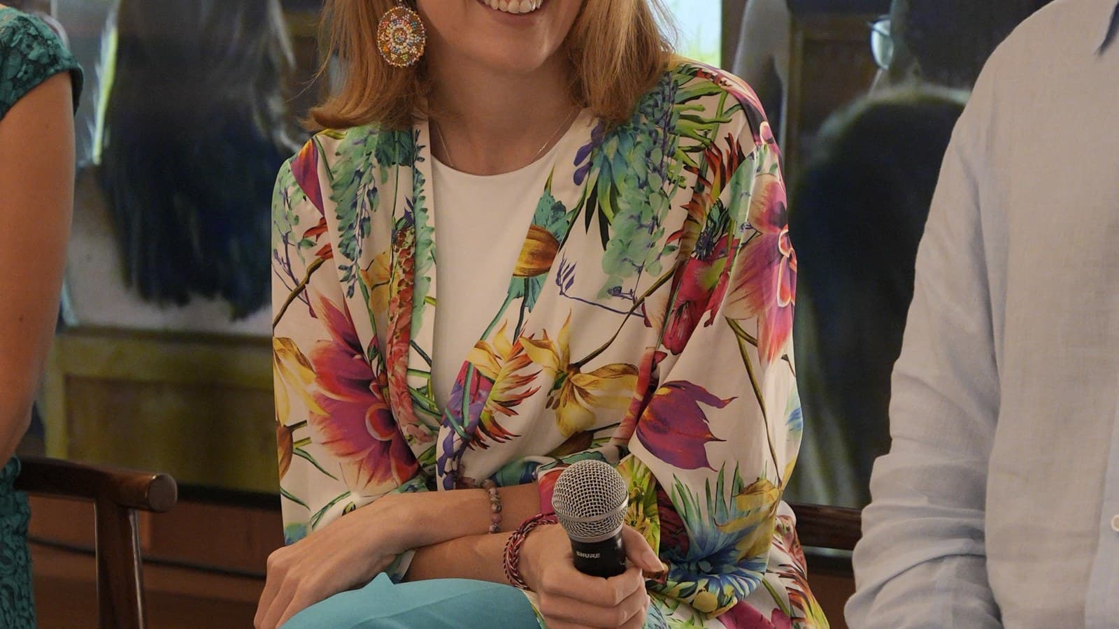 Kirsty Jayne Tait on stage in conversation with a leadership panel audience